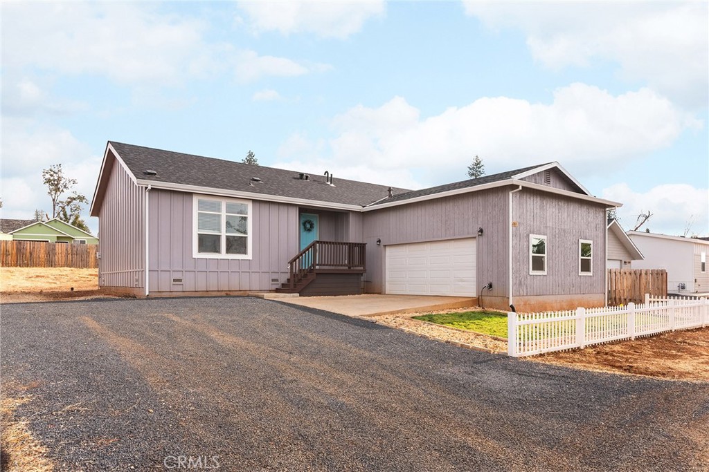 a view of a house with wooden floor and a big yard