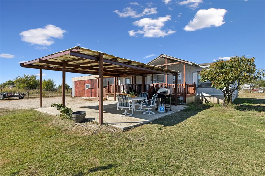 a view of a patio with swimming pool table and chairs