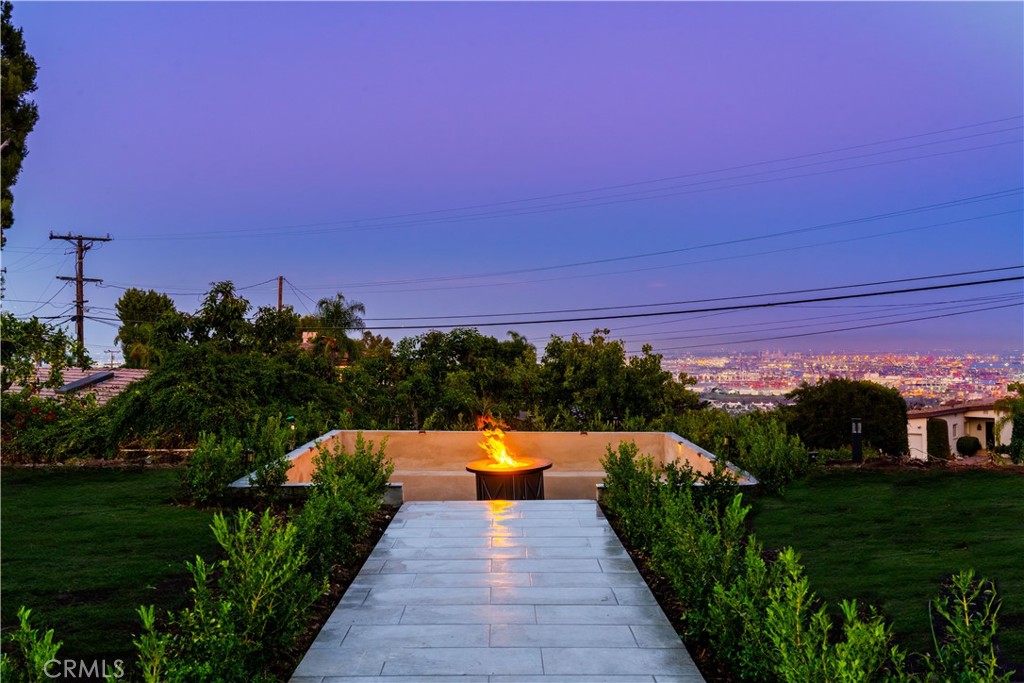 Front bifolds open out to front patio and path to seated firepit area