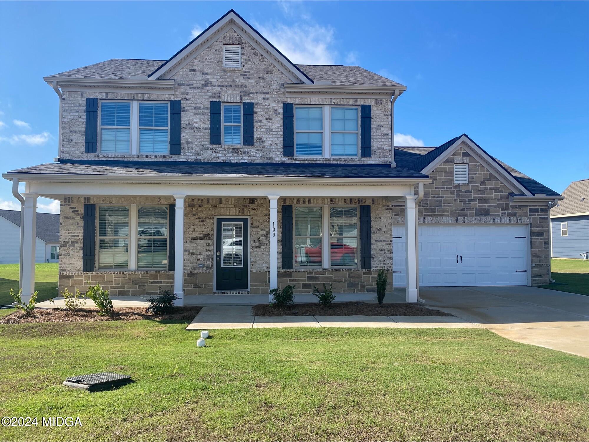 a front view of a house with a yard