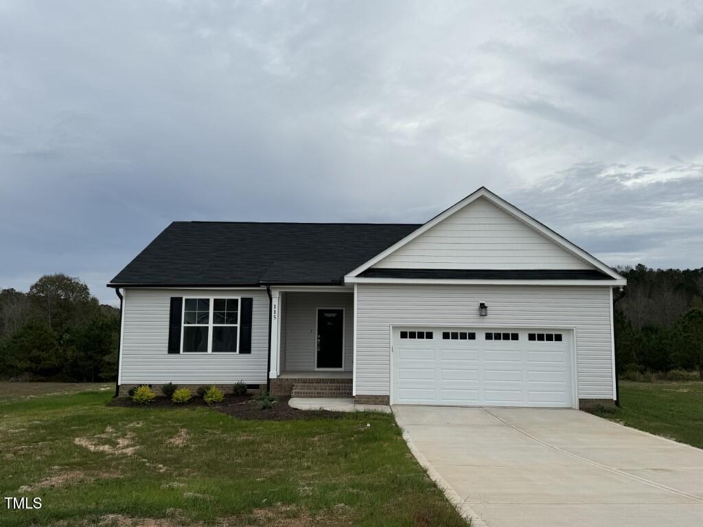 front view of a house with a yard