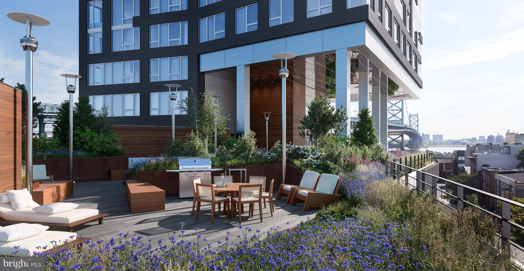 a view of a patio with table and chairs and potted plants