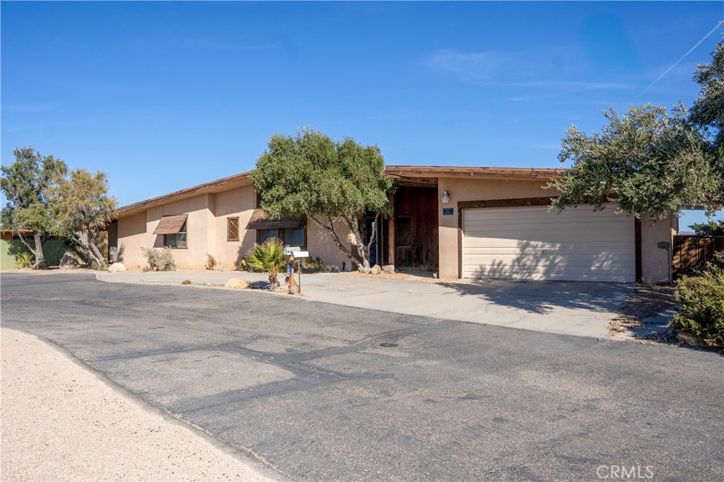 a view of a house with a outdoor space and street view