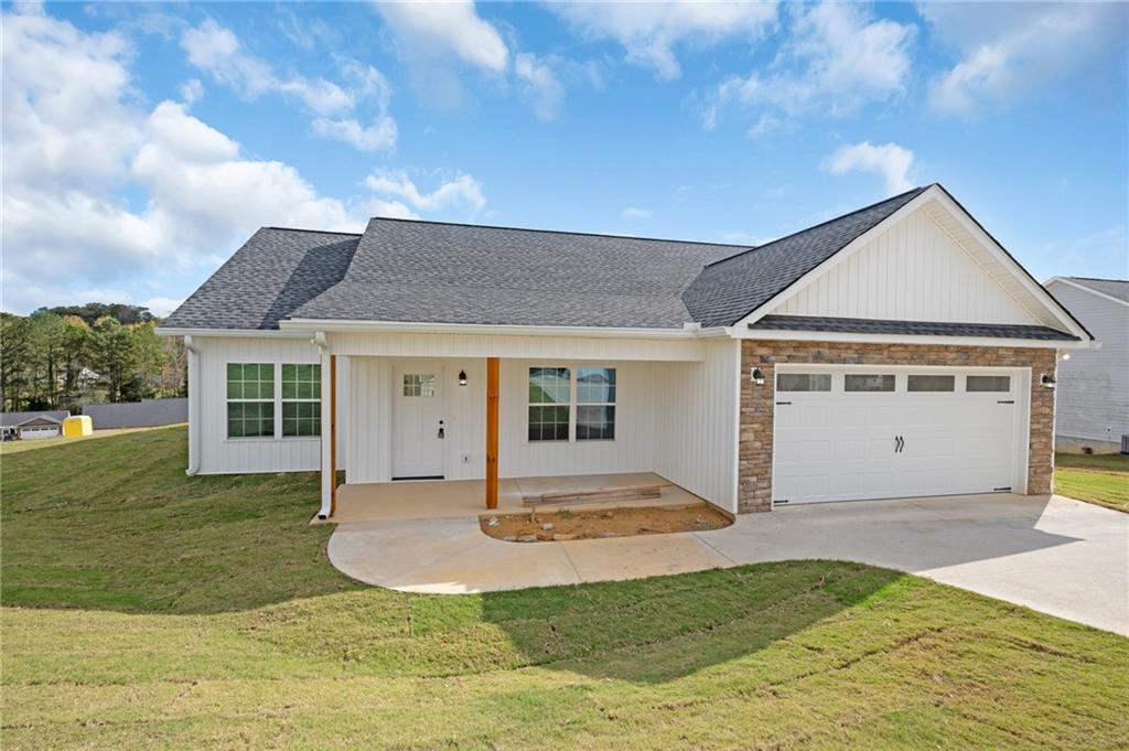 a front view of a house with a yard