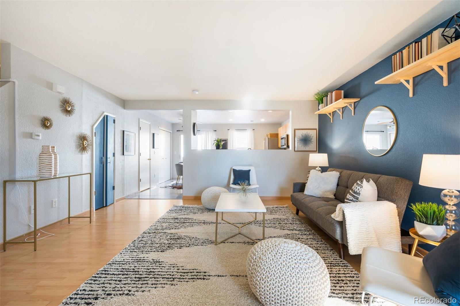 a living room with furniture and a rug