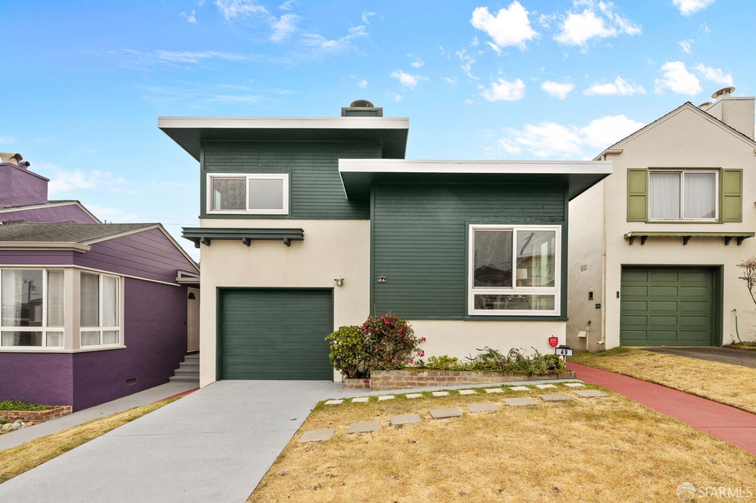 a front view of a house with a garage