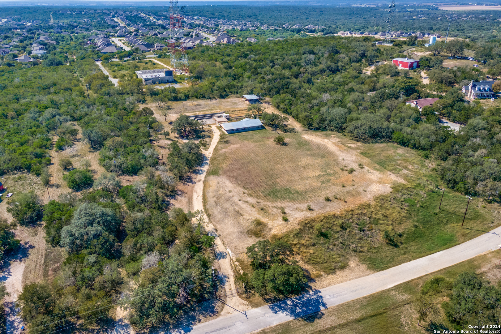 an aerial view of a house with a yard