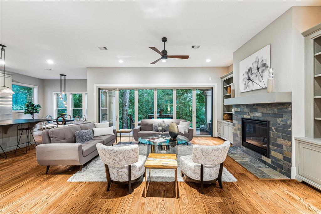 Stepping into this large family room, the first thing you will notice is the warm and inviting atmosphere. Natural light pours in from the windows, showcasing the space and brining the outdoors in.