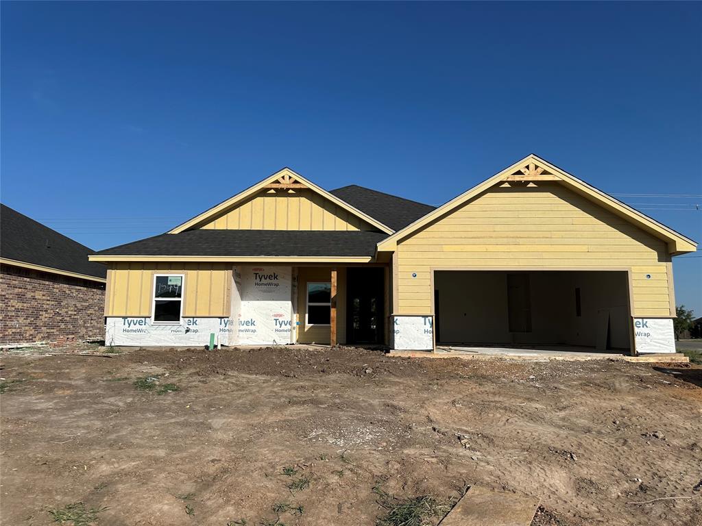 a front view of a house with yard