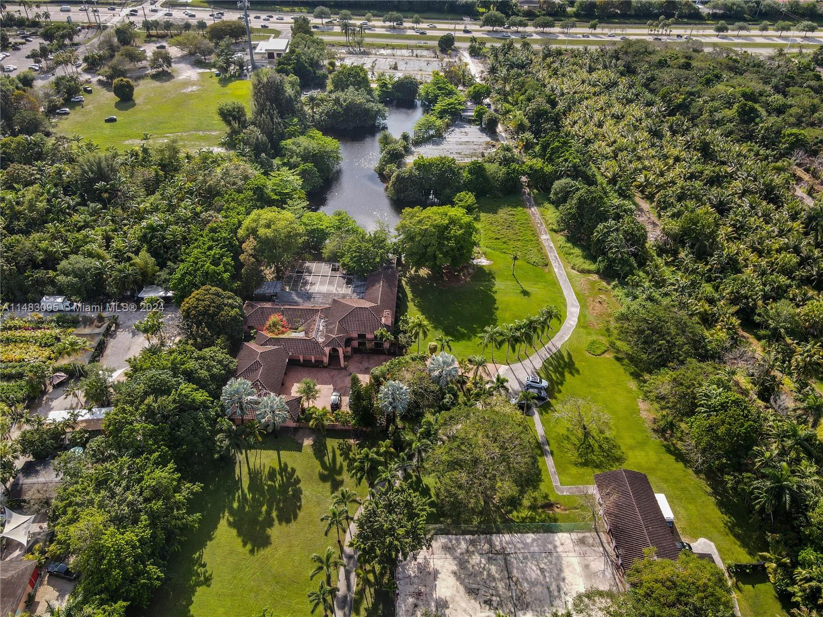 an aerial view of residential house with swimming pool and outdoor space