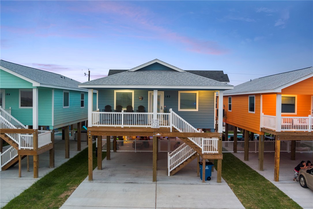 a backyard of a house with barbeque oven table and chairs