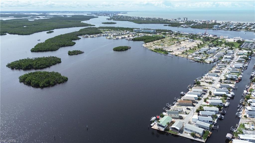 an aerial view of a house with a lake view