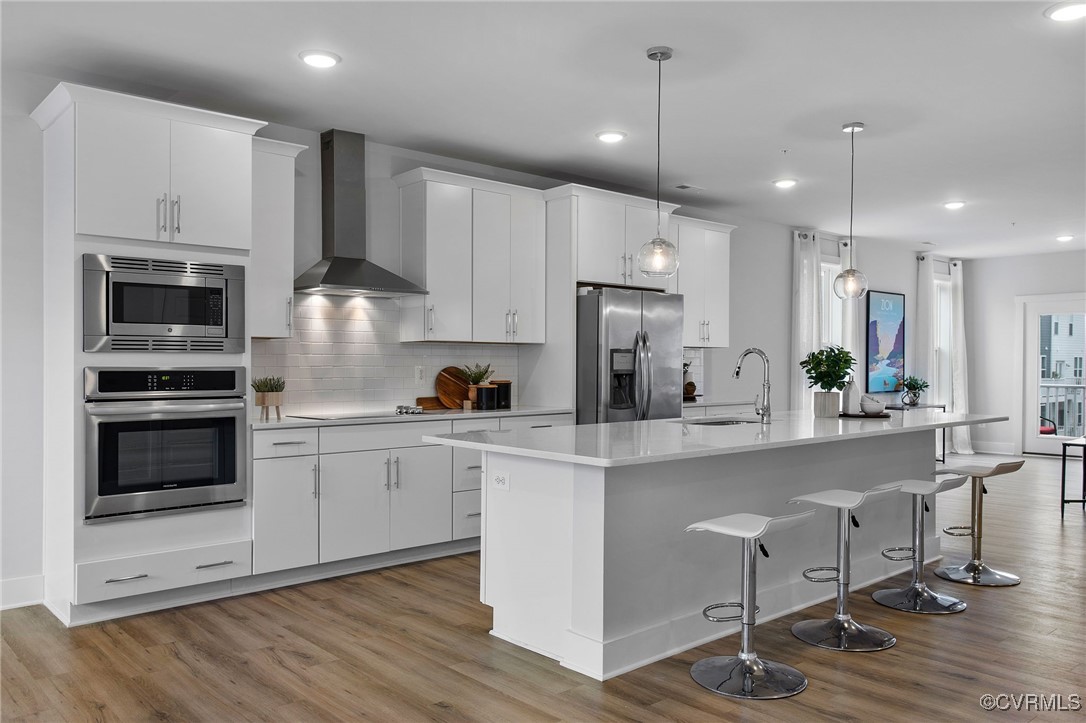 a kitchen with a sink stainless steel appliances and cabinets