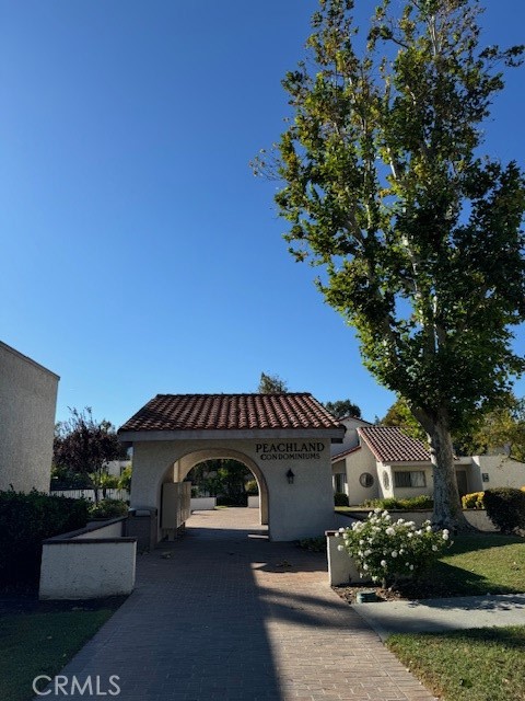 an outdoor view of house with garden space