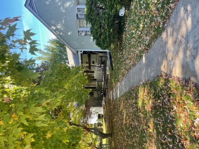 a front view of a house with garden