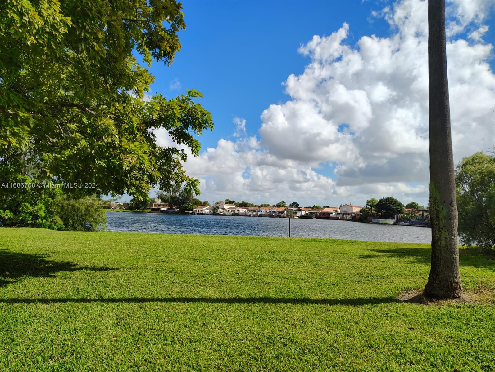 a view of a golf course with a lake