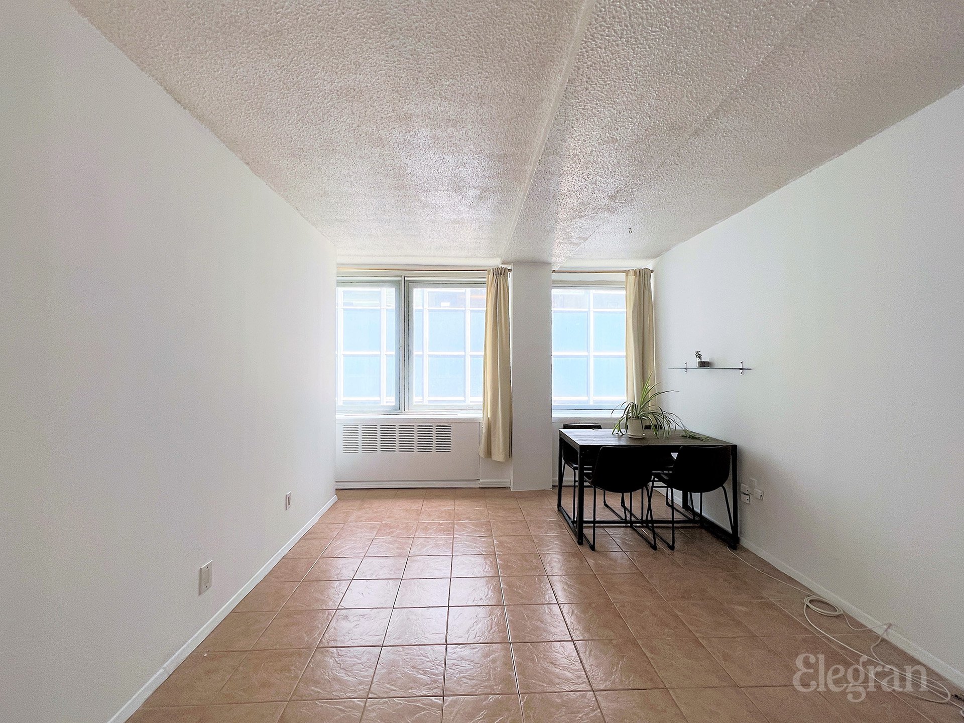 a view of a livingroom with furniture and window