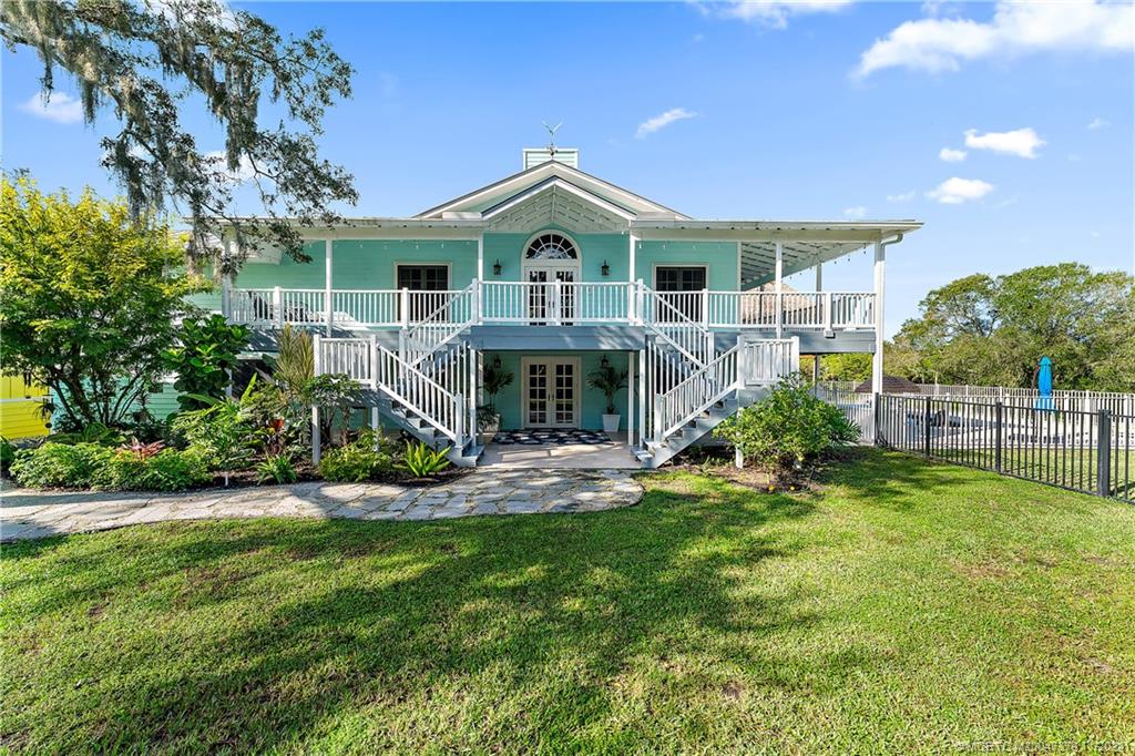 a front view of a house with a yard and porch