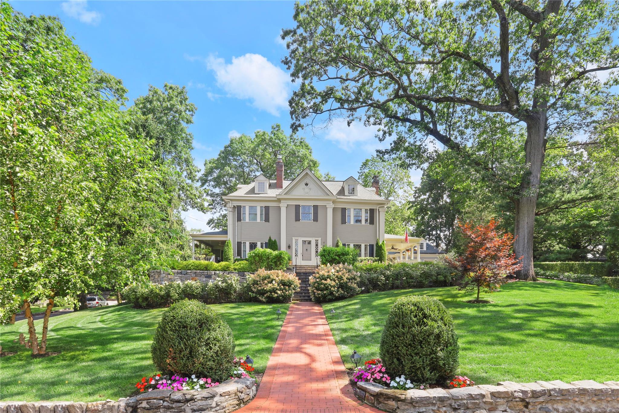 Colonial-style house with a front lawn