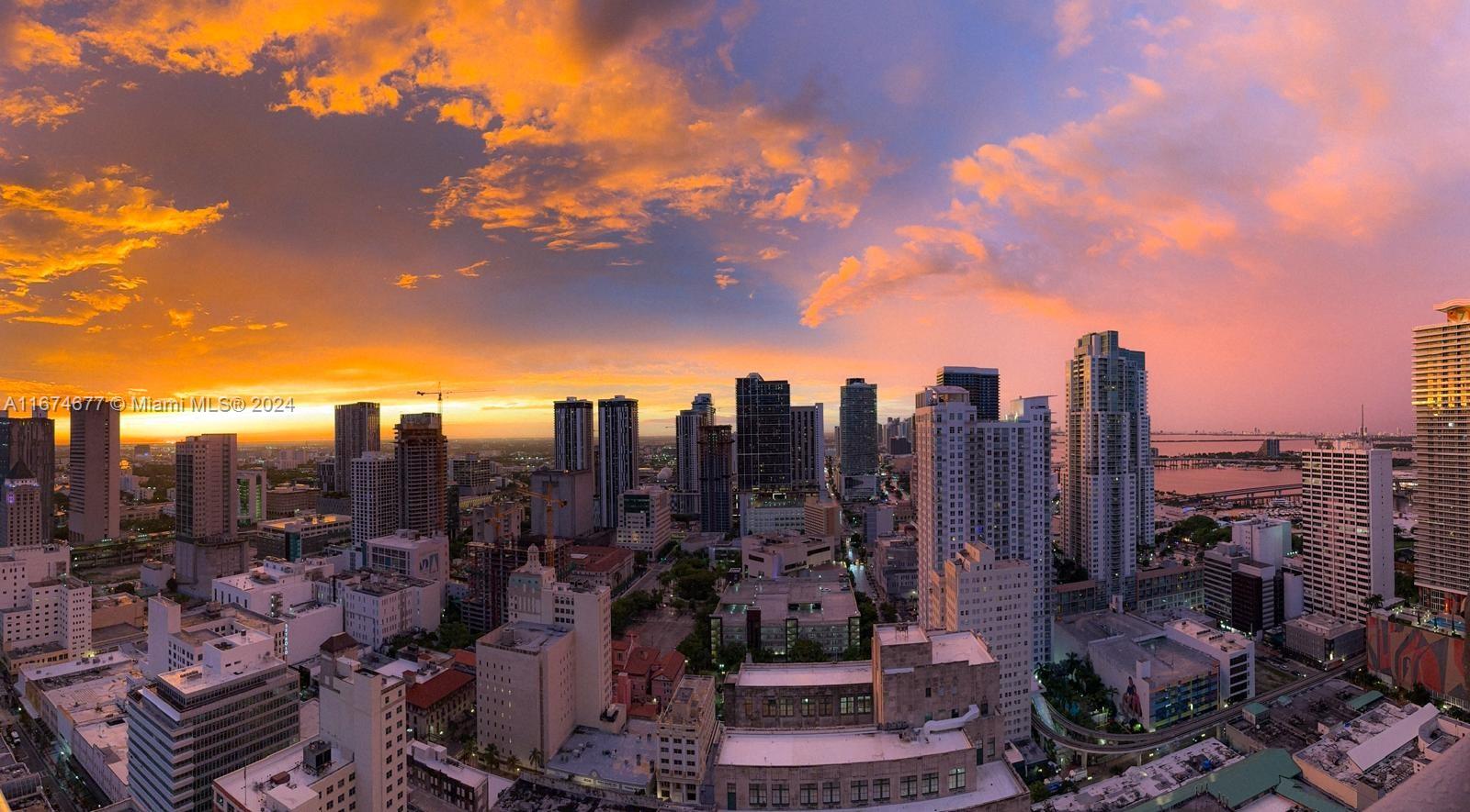 a view of a city with tall buildings