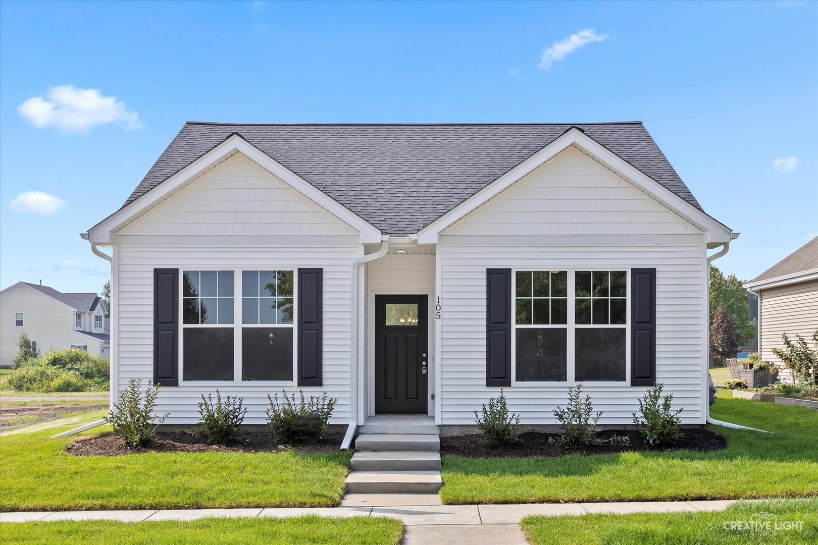 a front view of a house with a yard