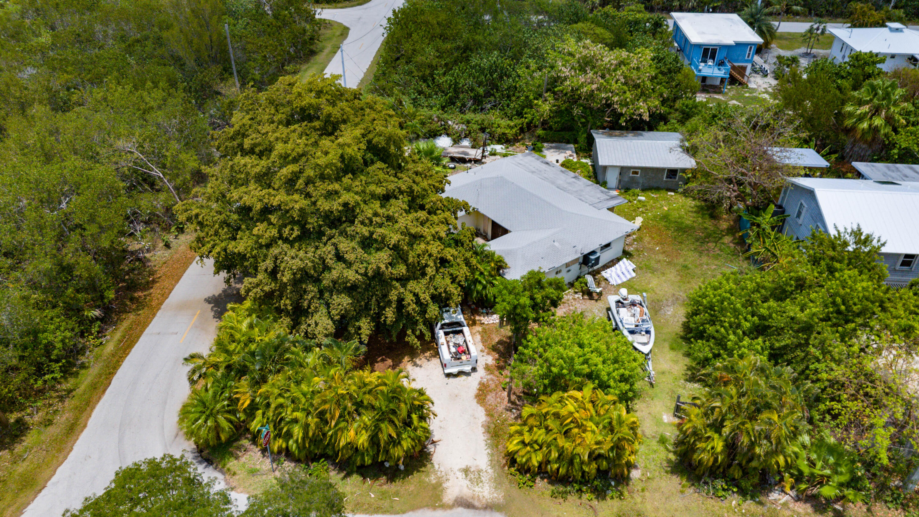 an aerial view of a house with a yard and garden