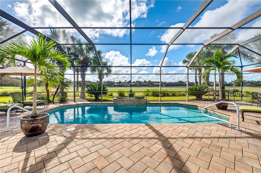 a view of swimming pool with sitting area