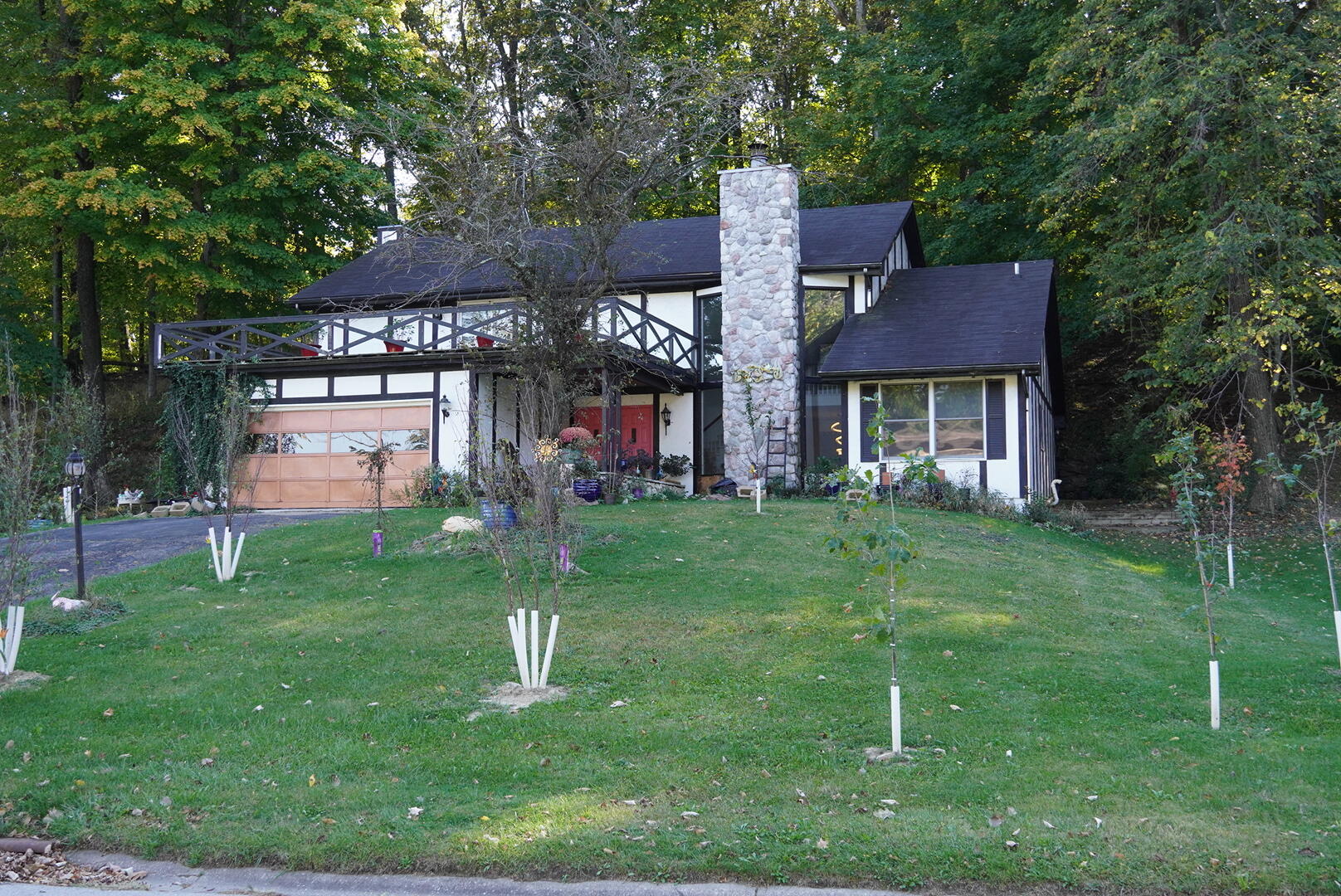 a front view of a house with a garden