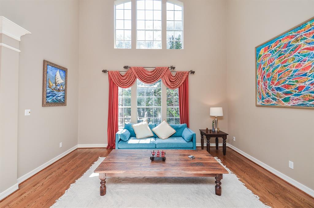 Two story living room flooded with plenty of natural light