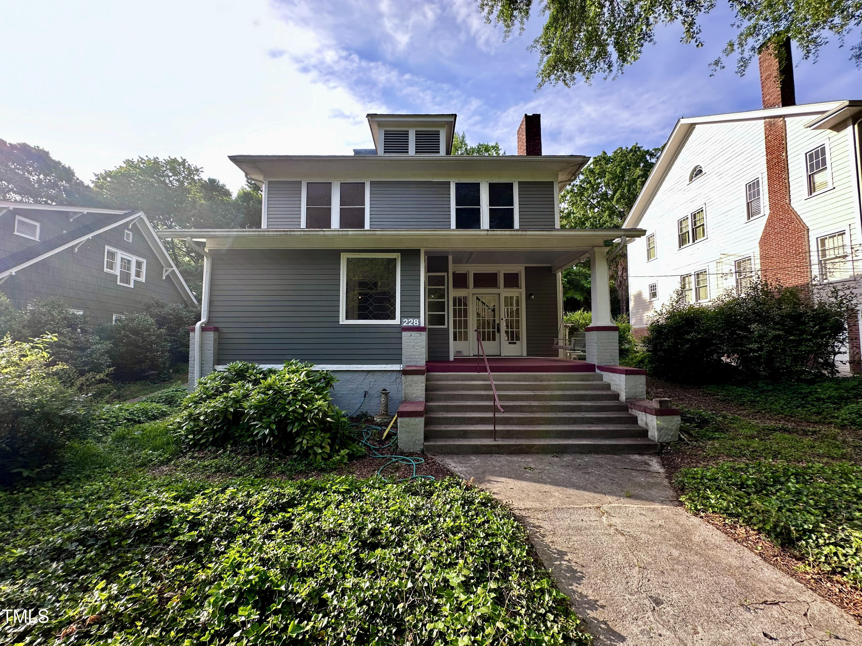 front view of a house with a yard