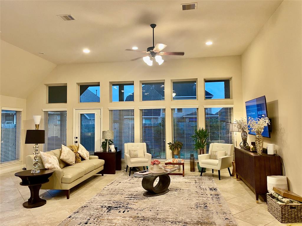 a living room with furniture and fireplace