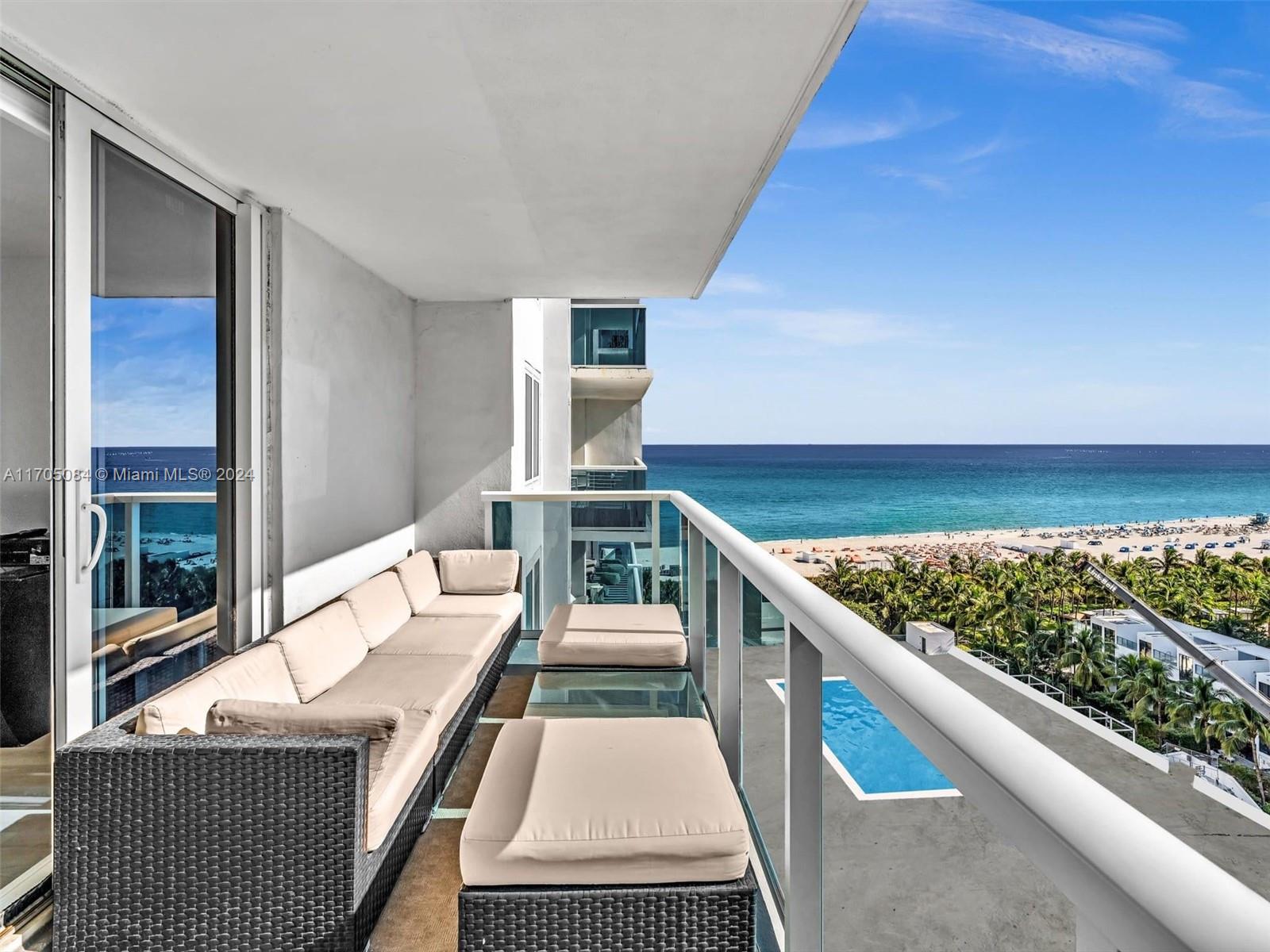 a living room with stainless steel appliances kitchen island granite countertop furniture and a kitchen view