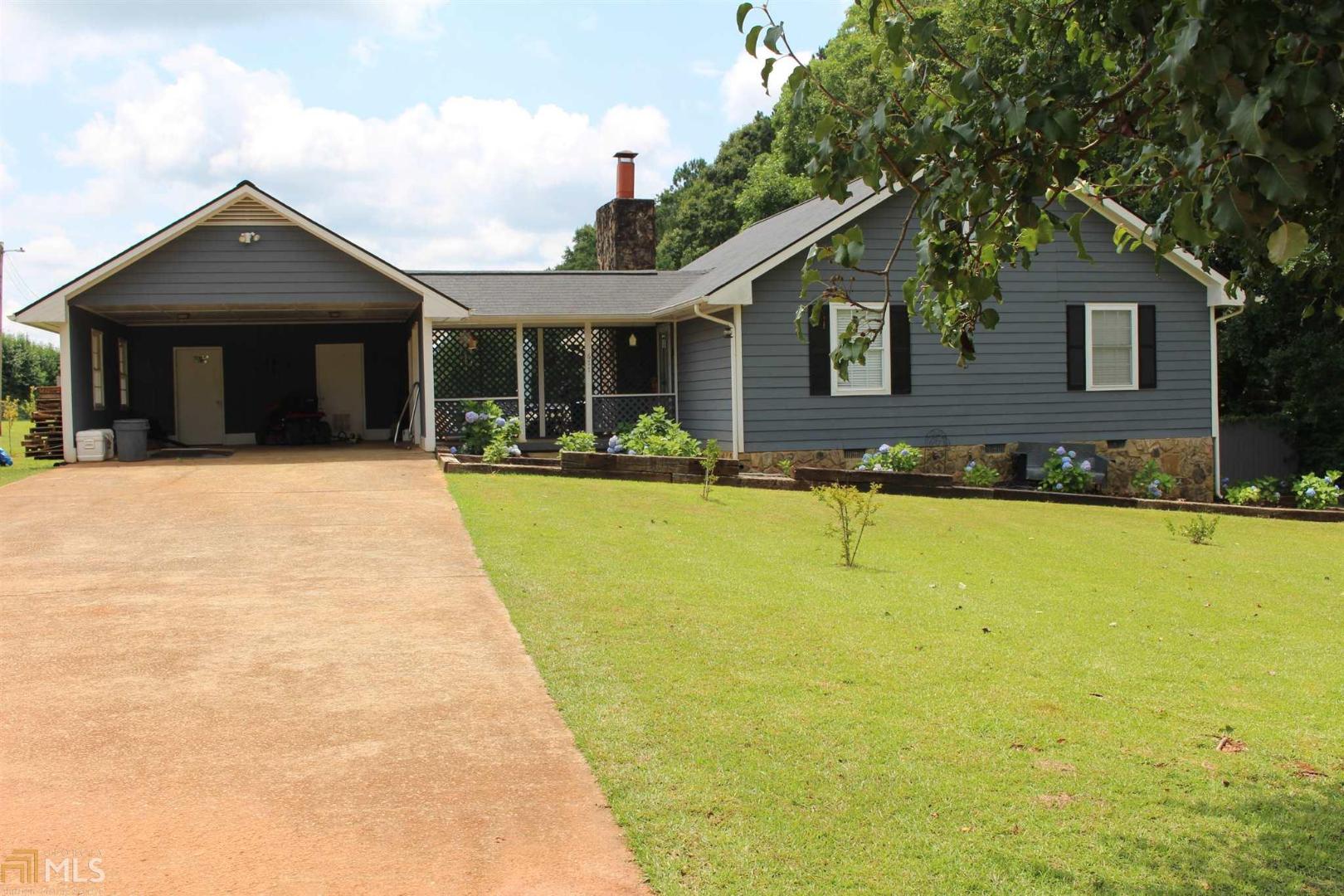 a view of house with yard