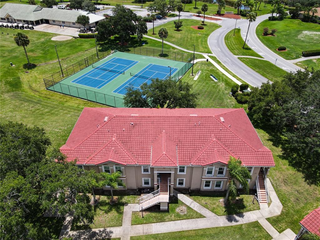 an aerial view of a house with yard swimming pool and outdoor seating