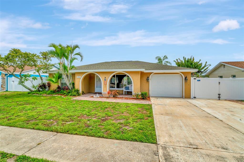 a front view of house with yard and entertaining space