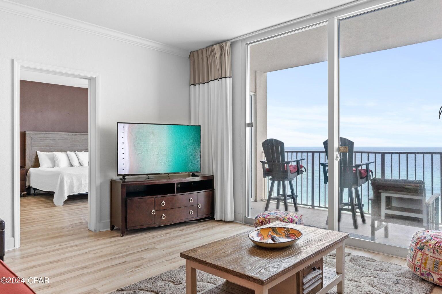 a living room with furniture and a flat screen tv