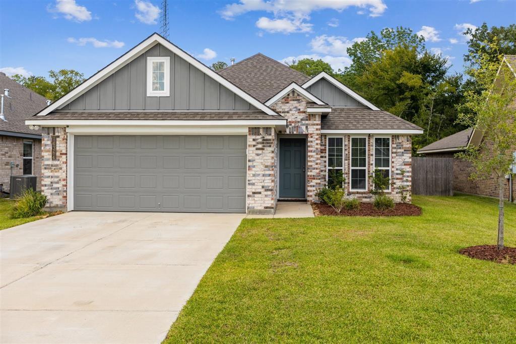 a front view of a house with yard