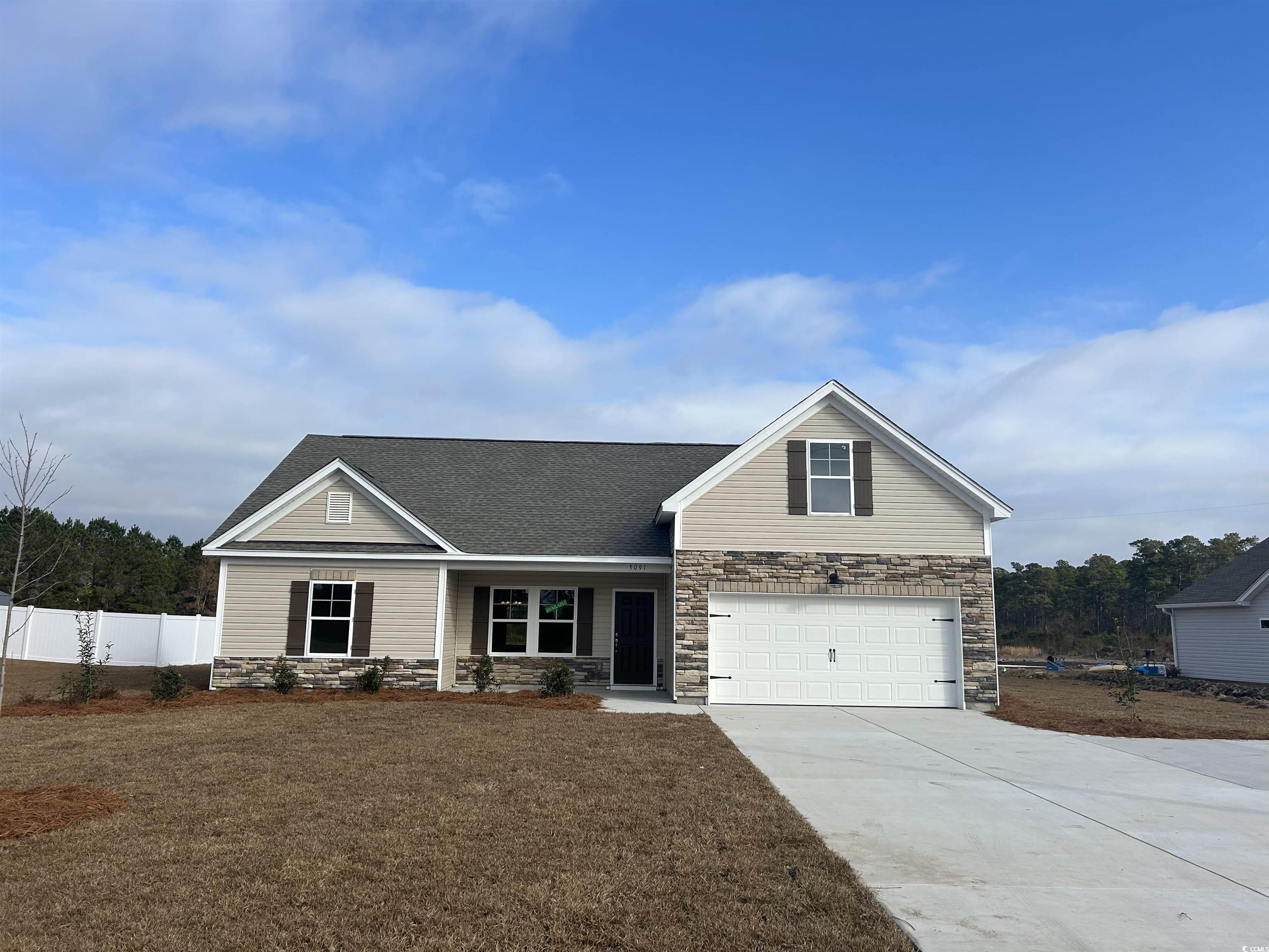 View of front of property featuring a garage