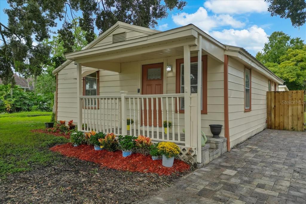 a view of a house with a yard and plants