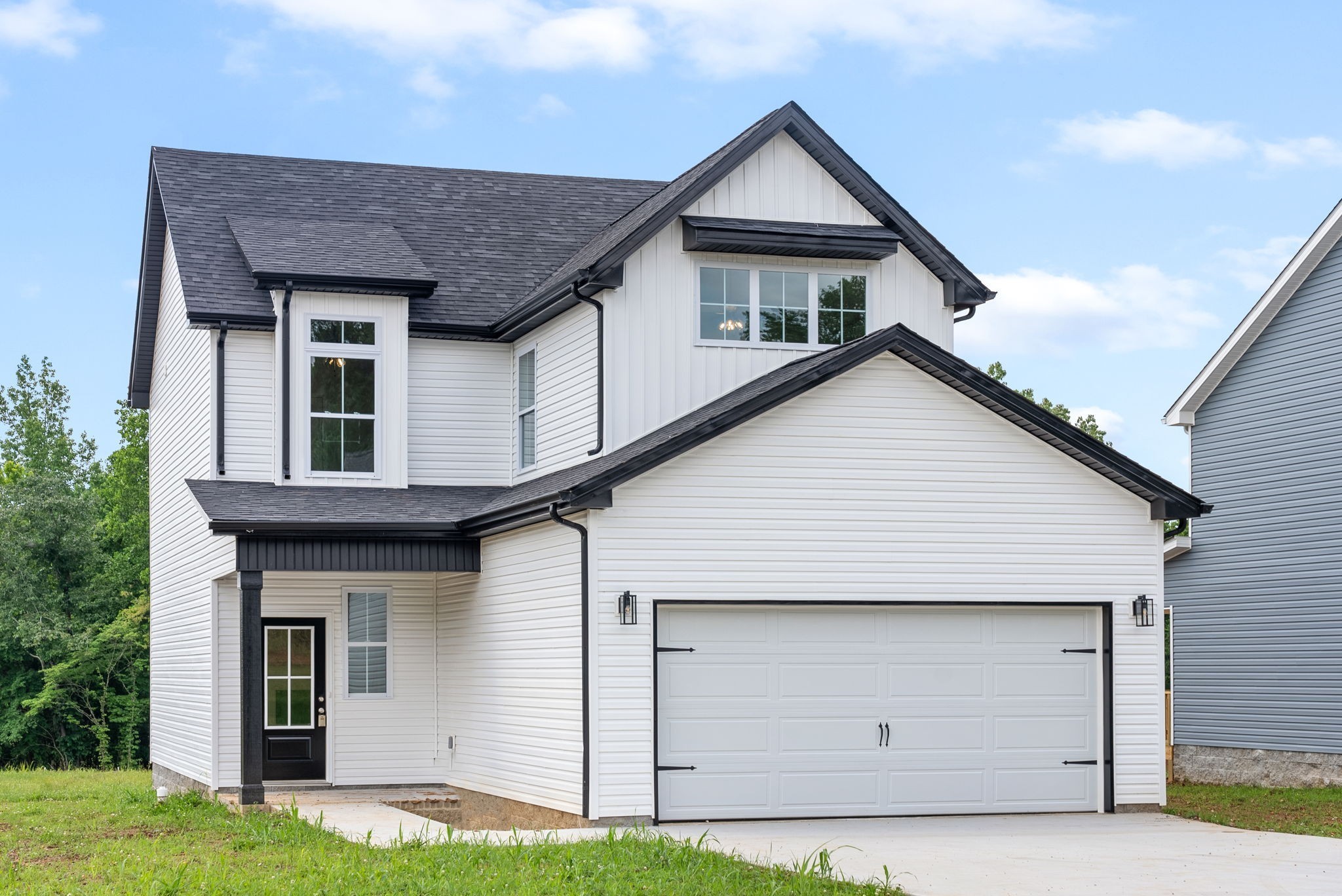 a front view of a house with garage