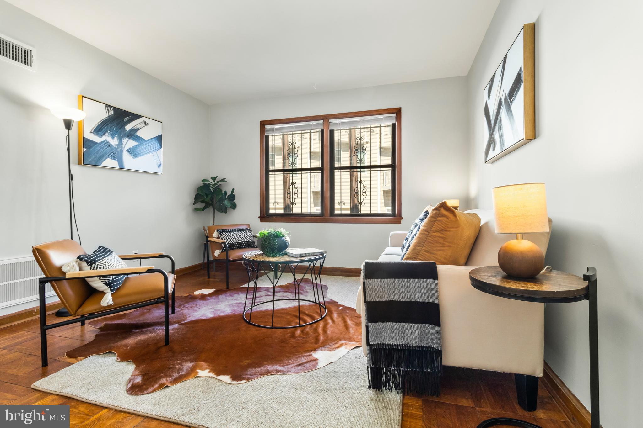 a living room with furniture and a window