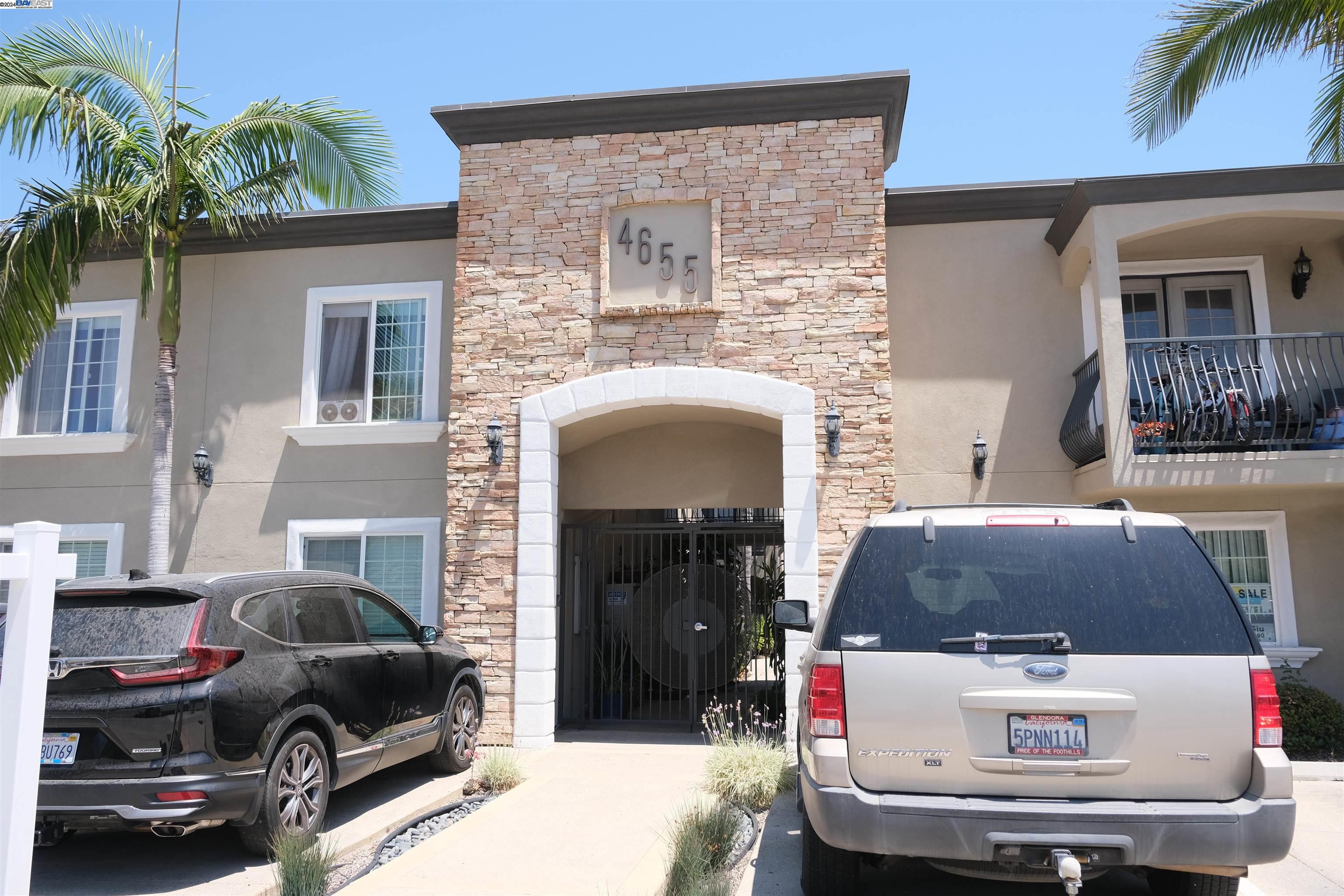 a front view of a house with parking space