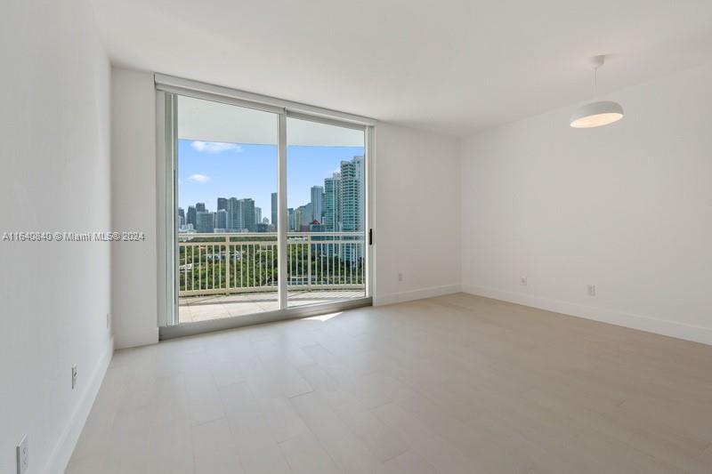 a view of an empty room with a balcony