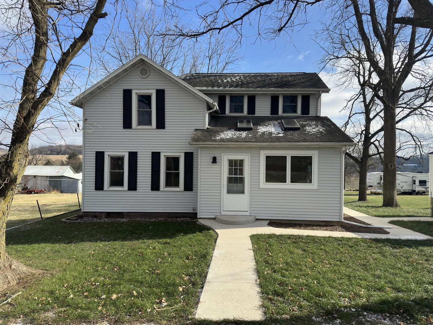 a front view of a house with a yard