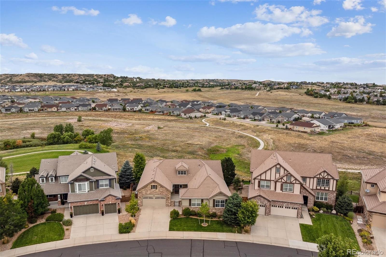 an aerial view of residential building with outdoor space and ocean view