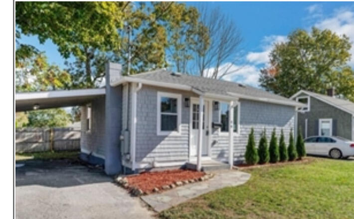 a front view of a house with a yard