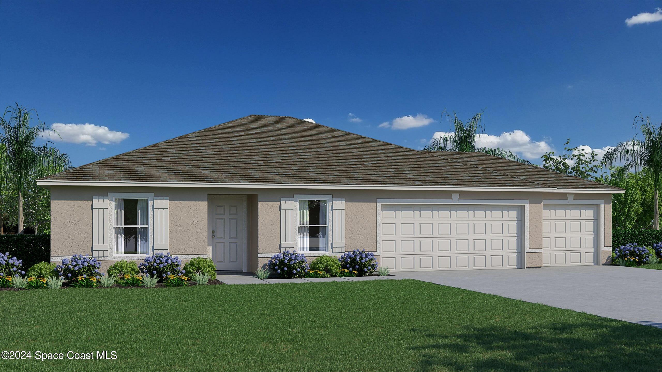 a front view of a house with a garden and yard