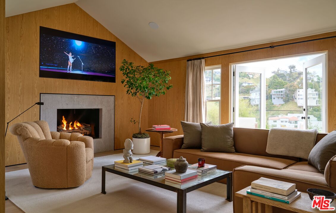 a living room with furniture a lamp and a fireplace