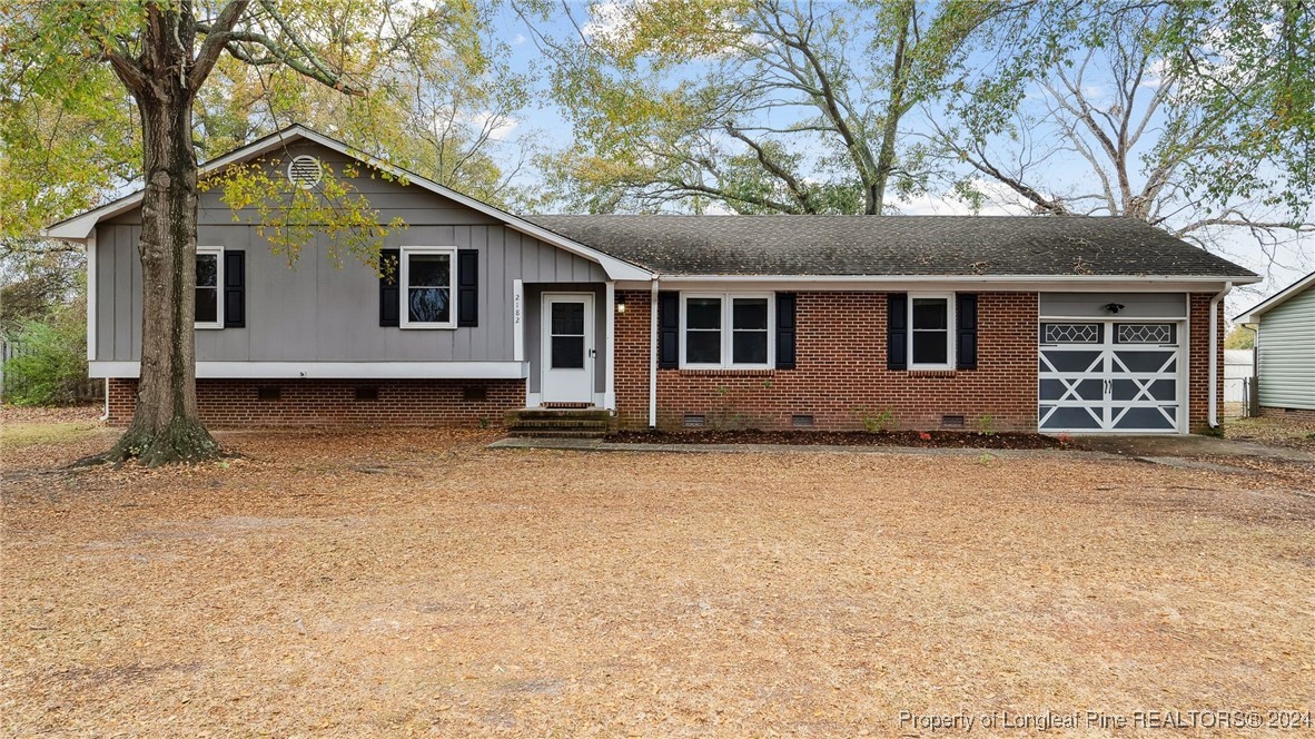 a house with trees in the background