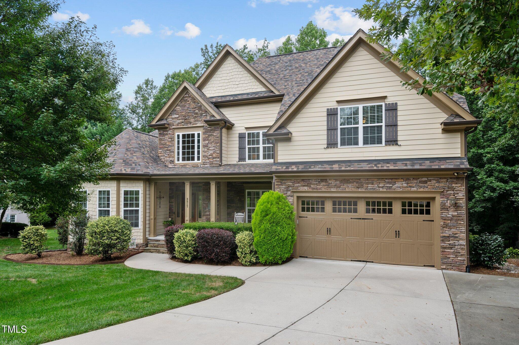 a view of a yard in front view of a house